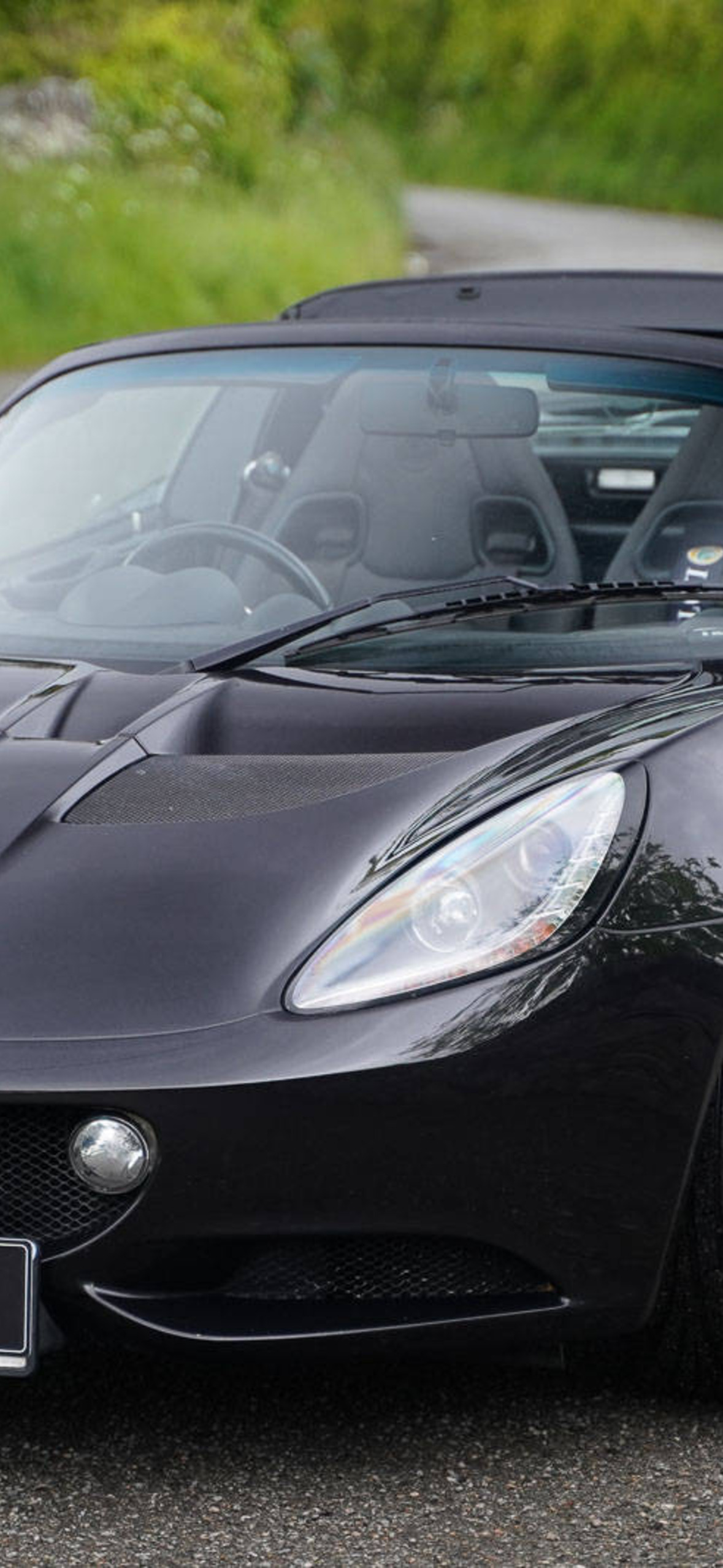 2013 Shiny Black Lotus Elise Convertible Car Aoy Ultra HD iPhone 16 Wallpaper