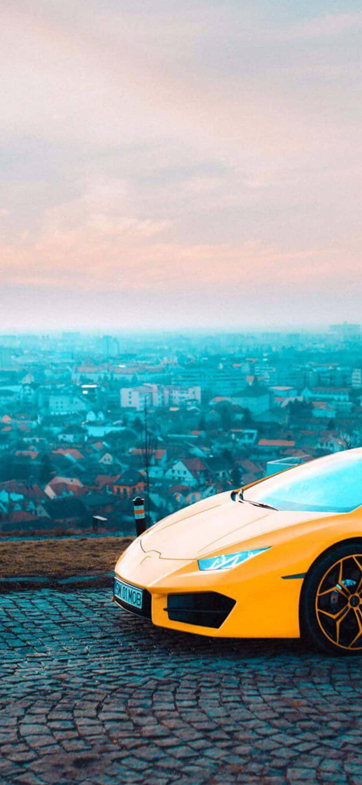 Extravagant Yellow Lamborghini Ultra HD iPhone 16 Wallpaper