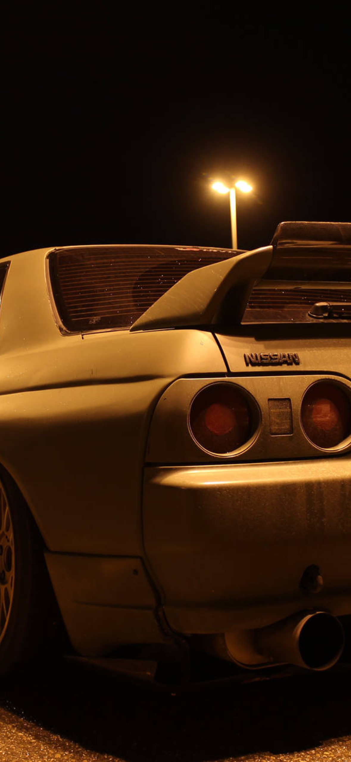 Caption Breathtaking View Of Classic Skyline R32 In The Wild Oxup Ultra HD iPhone 16 Wallpaper